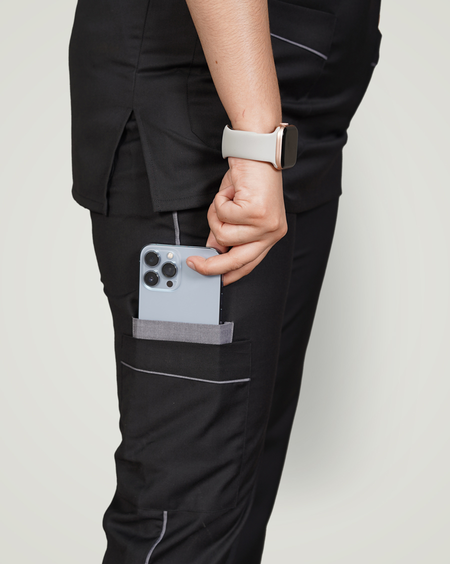 woman putting her mobile in trouser pocket